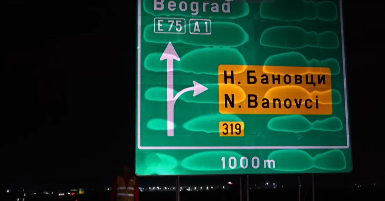 Highway sign covered with dew